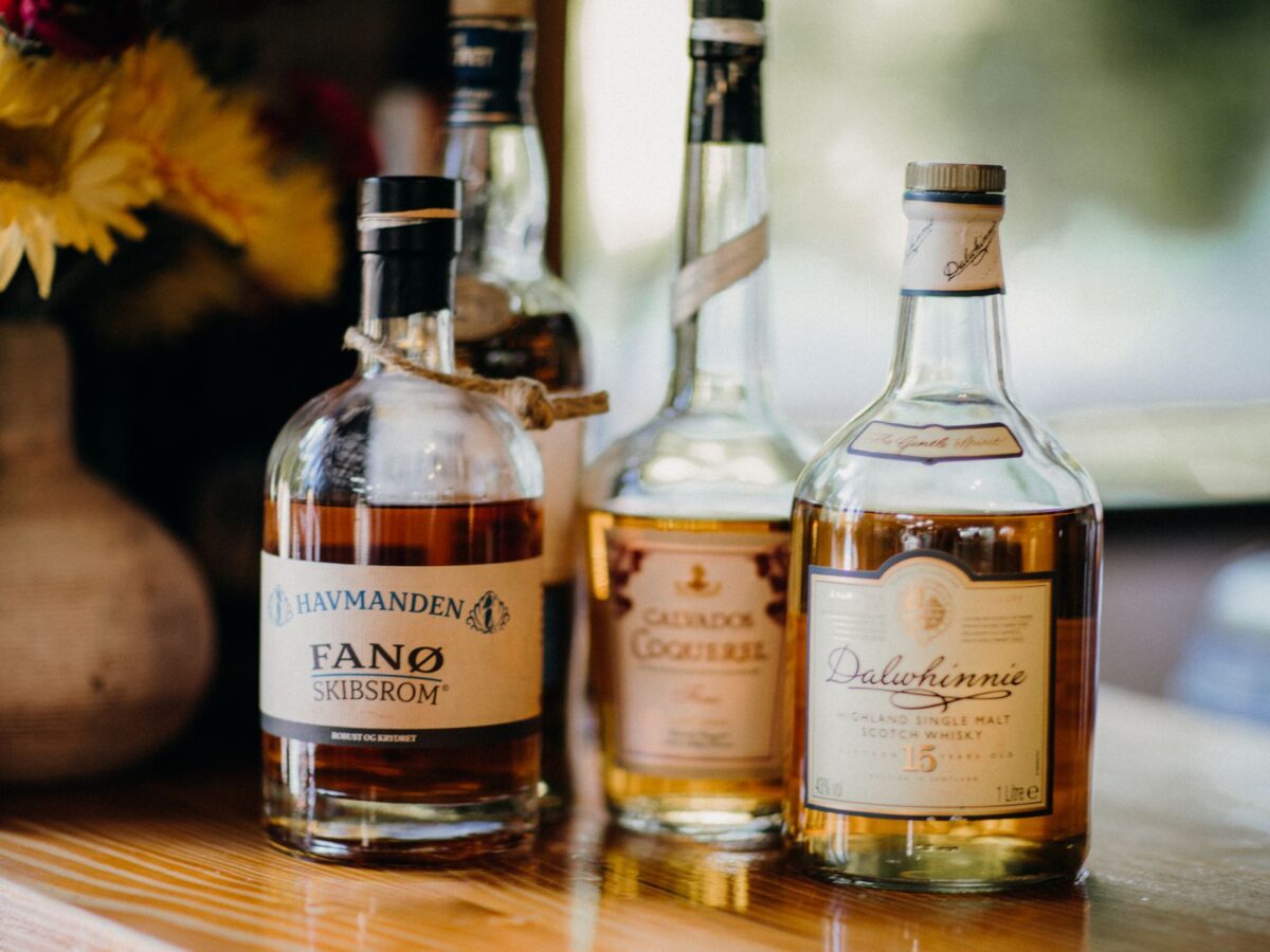 photograph of a bottle of whisky beside a bottle of rum